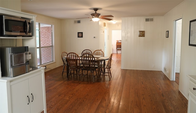 dining room featuring ceiling fan and dark hardwood / wood-style floors