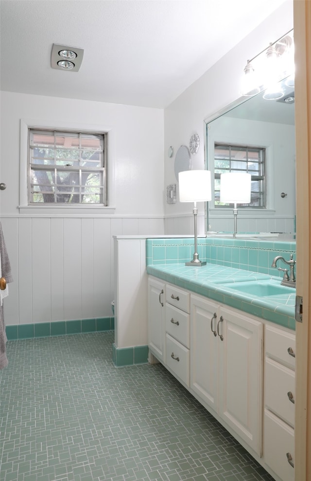 bathroom with a wealth of natural light and vanity