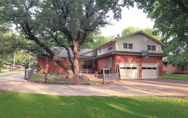 view of front of house with a garage and a front lawn