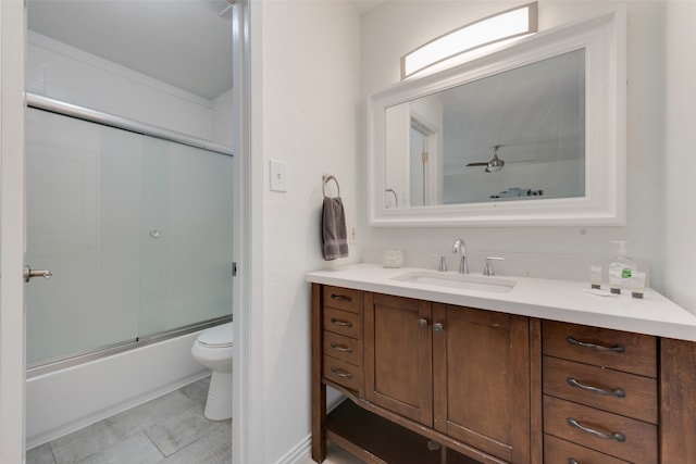 full bathroom with vanity, combined bath / shower with glass door, and toilet