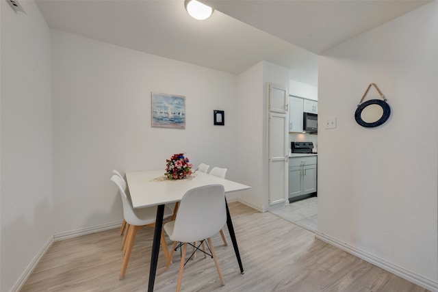 dining room featuring light wood-type flooring