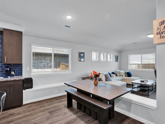 dining room with dark hardwood / wood-style floors