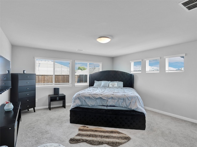 bedroom with light colored carpet