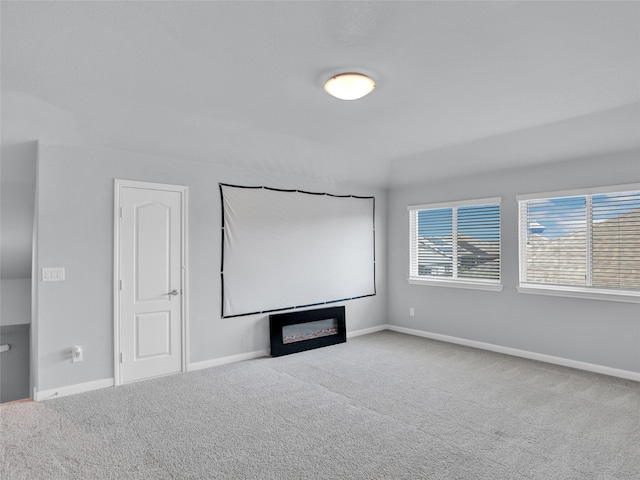 home theater with light colored carpet