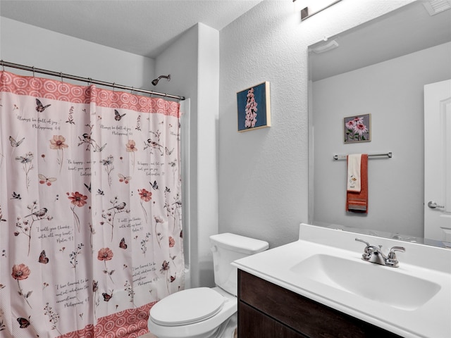 full bathroom with toilet, shower / tub combo, vanity, and a textured ceiling