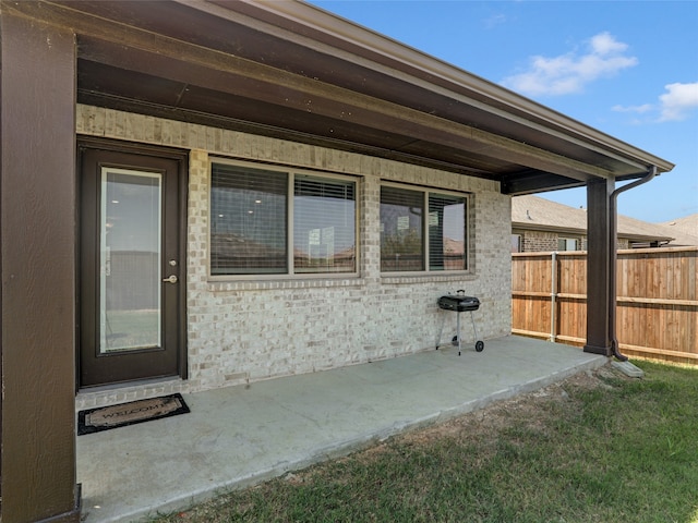 entrance to property featuring a patio area