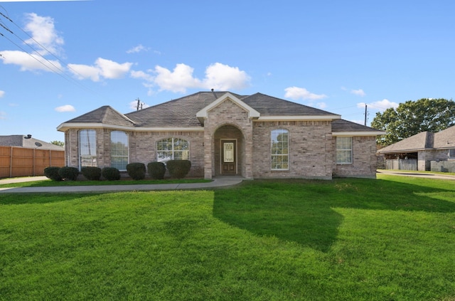 ranch-style house with a front yard