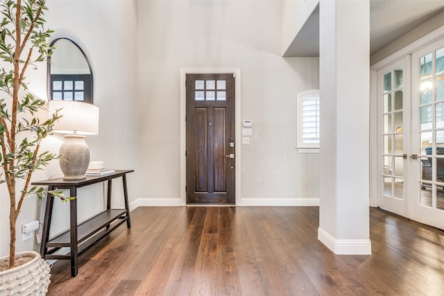 foyer entrance with dark hardwood / wood-style flooring and french doors