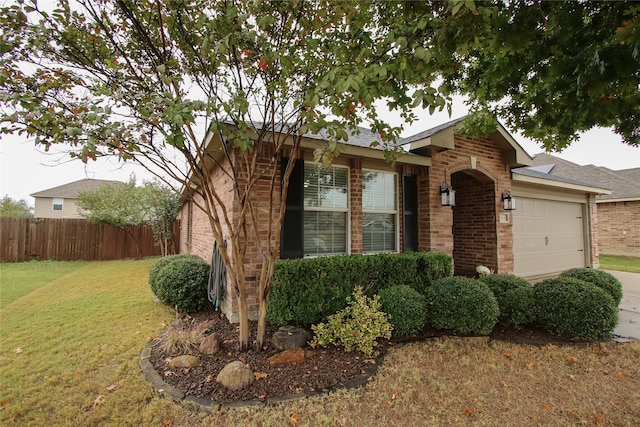 single story home with a front lawn and a garage