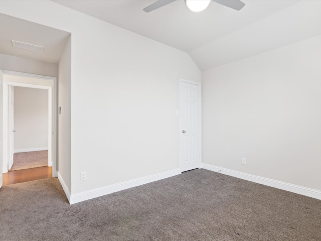 carpeted spare room with lofted ceiling and ceiling fan