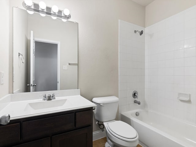 full bathroom with toilet, tiled shower / bath combo, and vanity