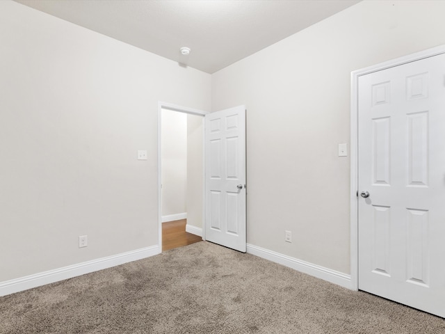 unfurnished room featuring carpet floors