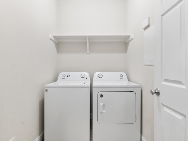 washroom featuring washer and clothes dryer