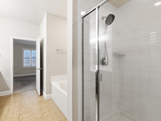 bathroom with shower with separate bathtub