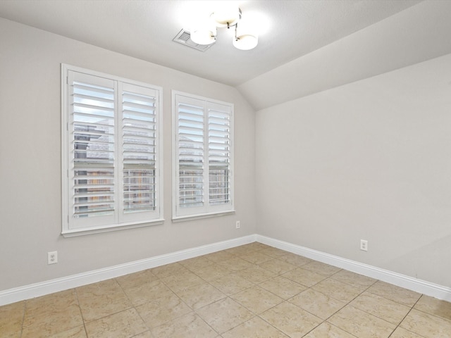 1200 Roadrunner Dr, Little Elm, TX 75068 - spare room featuring baseboards, light tile patterned flooring, and vaulted ceiling