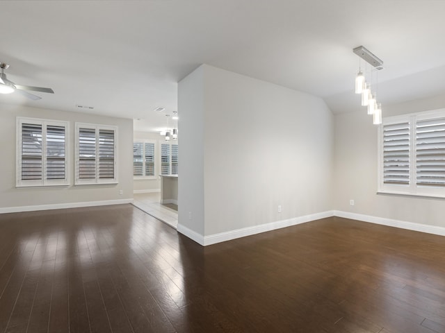 empty room featuring dark hardwood / wood-style floors and ceiling fan