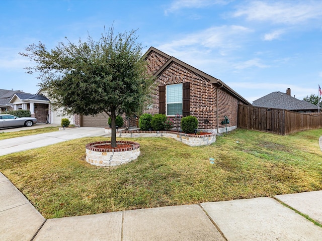 view of front of home featuring a front yard and a garage