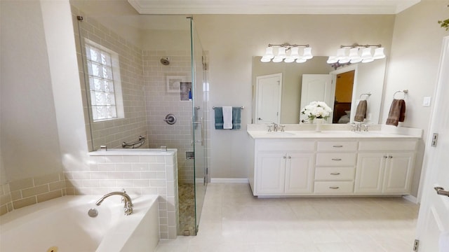 bathroom featuring a garden tub, crown molding, double vanity, a stall shower, and a sink