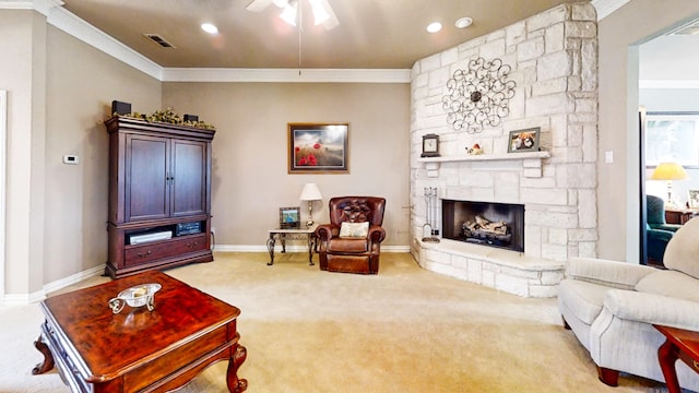 living area featuring a stone fireplace, visible vents, baseboards, carpet, and crown molding