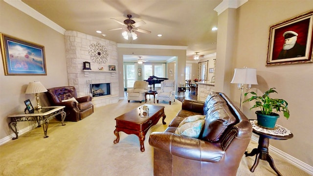 living room with carpet, a fireplace, ornamental molding, and baseboards