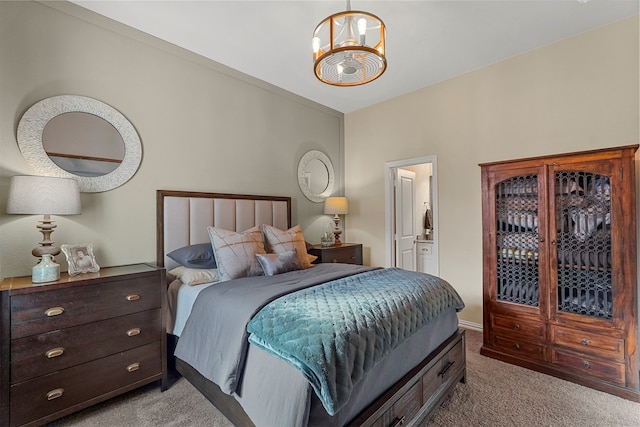 carpeted bedroom with a notable chandelier