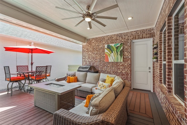 deck with ceiling fan and an outdoor hangout area