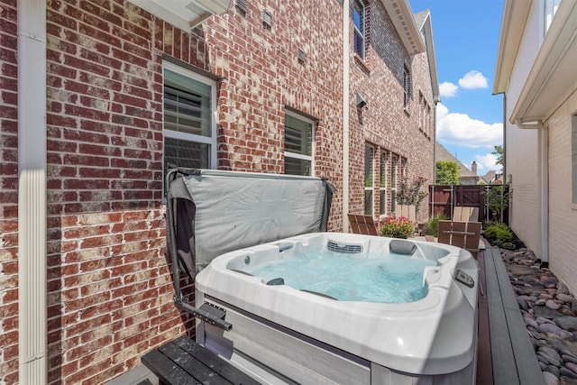 view of patio / terrace featuring a hot tub