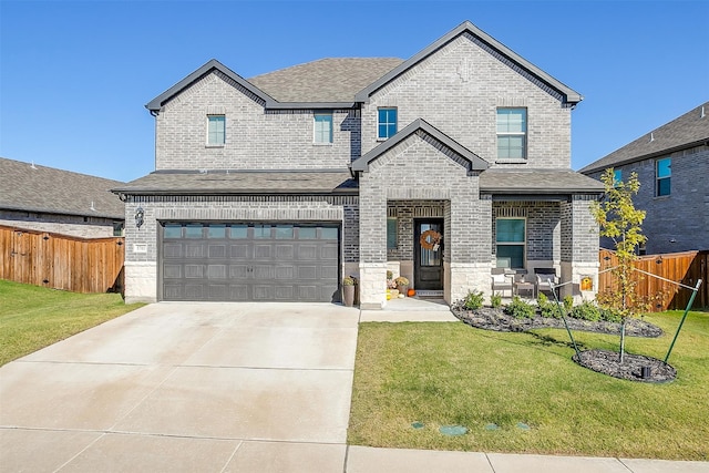 view of front of house with a garage and a front yard