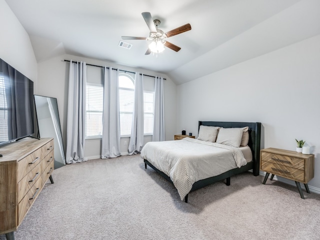 carpeted bedroom with ceiling fan and lofted ceiling