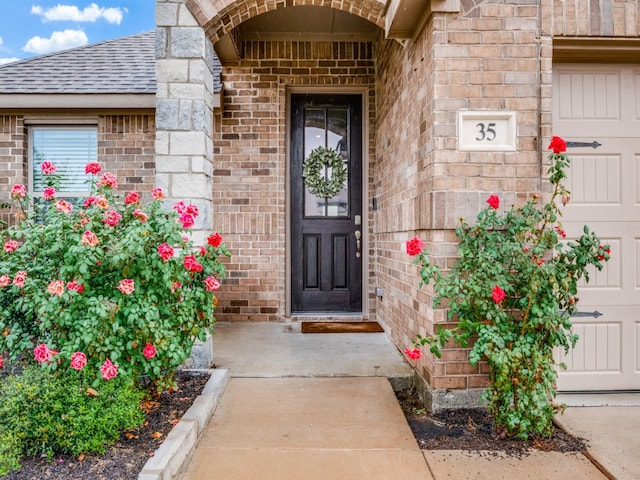 doorway to property featuring a garage