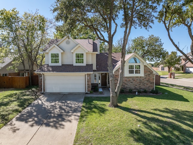 view of front of home featuring a garage and a front lawn