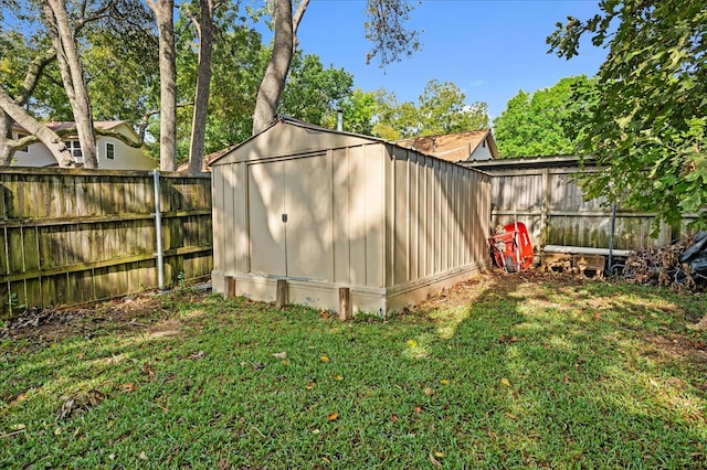 view of outbuilding with a lawn