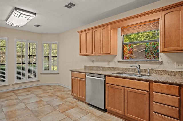 kitchen featuring dishwasher and sink