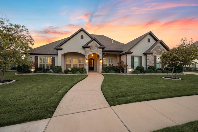 french country style house with a yard