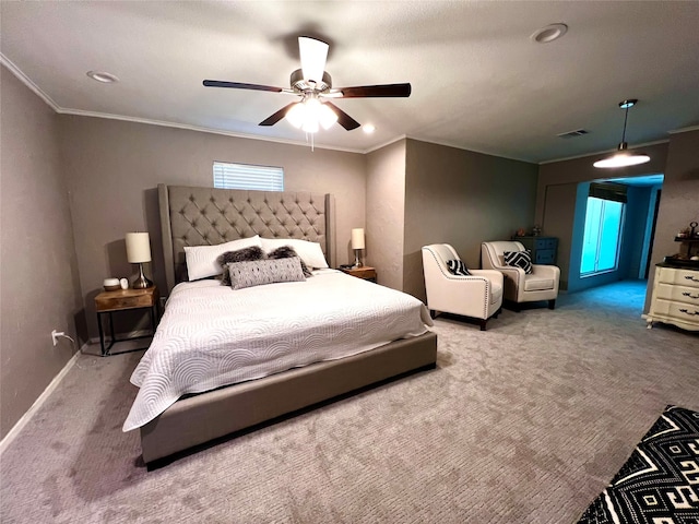 bedroom featuring ceiling fan, crown molding, and carpet