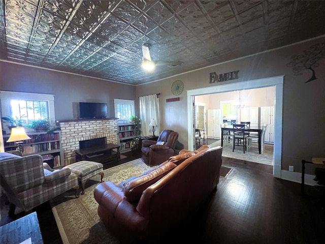 living room featuring hardwood / wood-style floors and a brick fireplace