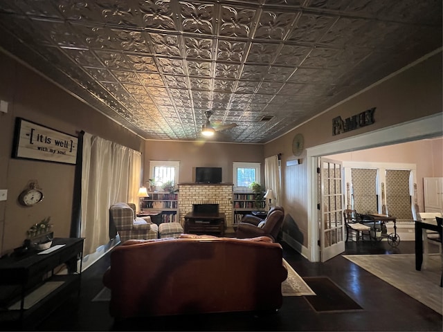 living room featuring ceiling fan and wood-type flooring