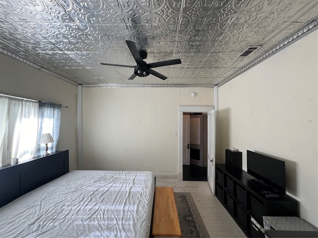 bedroom with hardwood / wood-style floors and ceiling fan