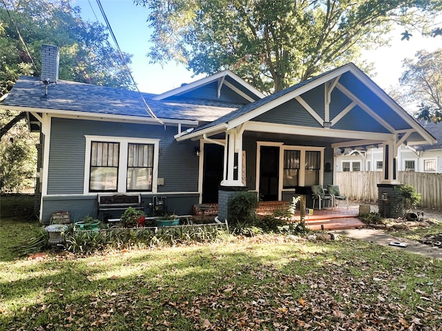 back of property with covered porch