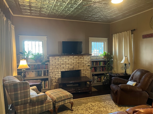 living room with crown molding and wood-type flooring