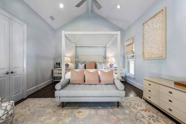 bedroom featuring dark wood-type flooring, ceiling fan, vaulted ceiling, and a closet