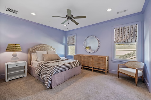 bedroom with carpet flooring, multiple windows, ceiling fan, and crown molding