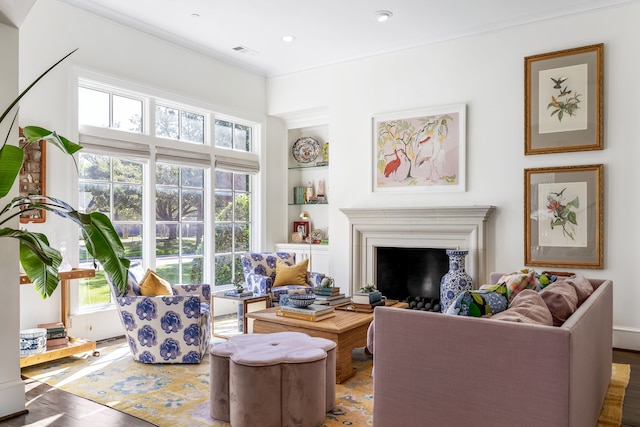 living room featuring ornamental molding and hardwood / wood-style flooring