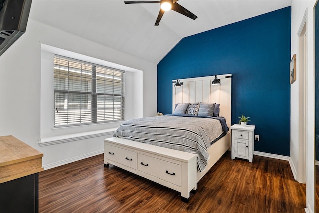 bedroom featuring dark hardwood / wood-style flooring, lofted ceiling, and ceiling fan