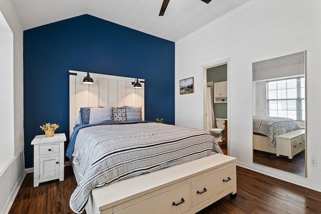 bedroom with dark hardwood / wood-style flooring, lofted ceiling, connected bathroom, and ceiling fan