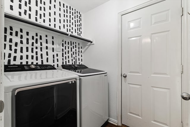 clothes washing area featuring independent washer and dryer