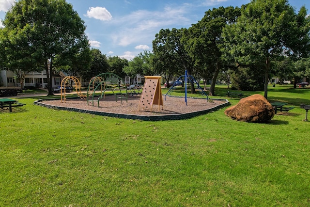 view of playground with a lawn