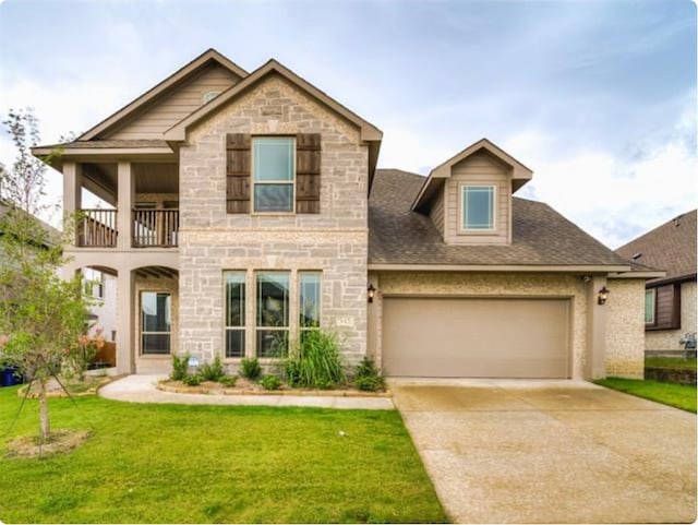 view of front of property with a front lawn and a balcony