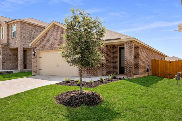 view of front of house with a garage and a front yard