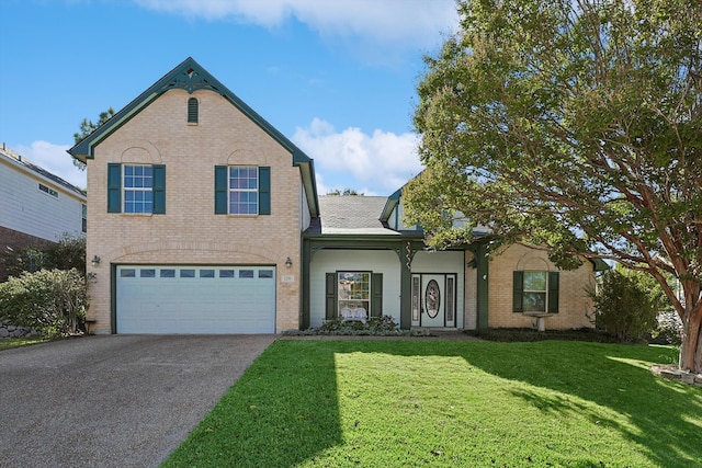 view of front of home featuring a garage and a front lawn